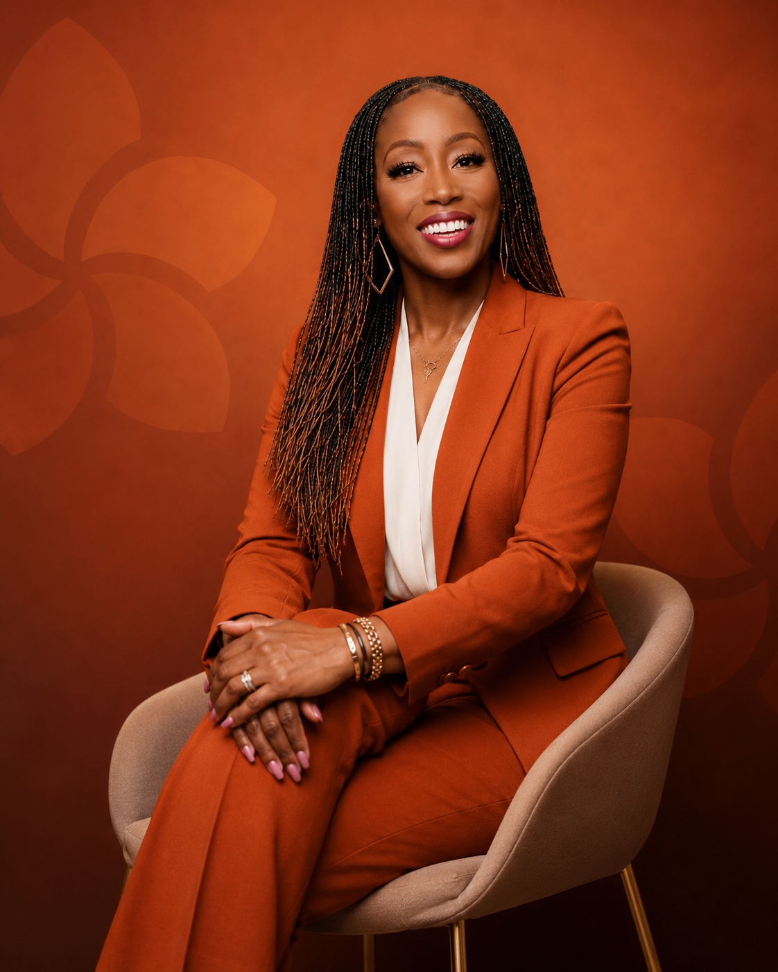 Executive portrait of Coach Zykina Stewart in an orange suit